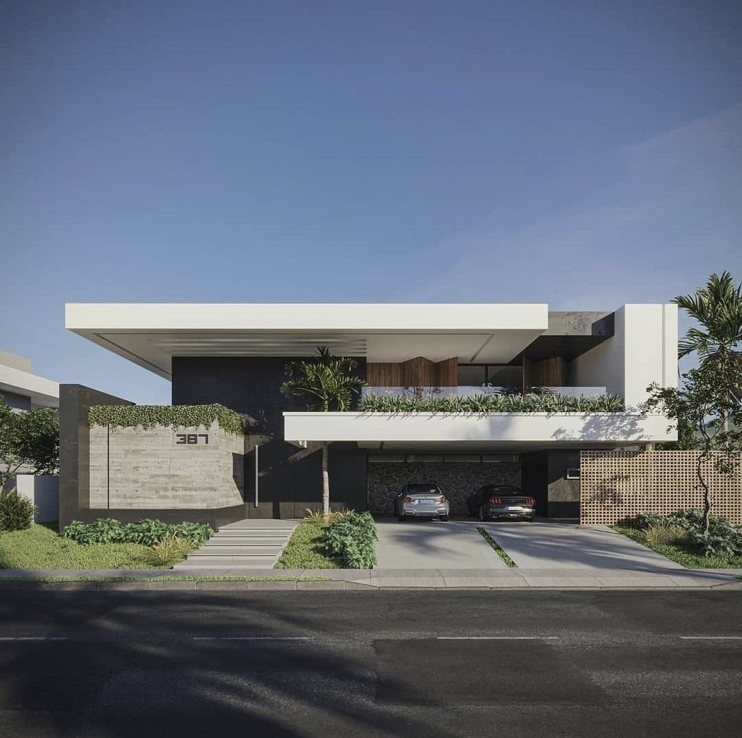 Casa contemporánea blanca con losa en voladizo, muro de hormigón y terraza ajardinada